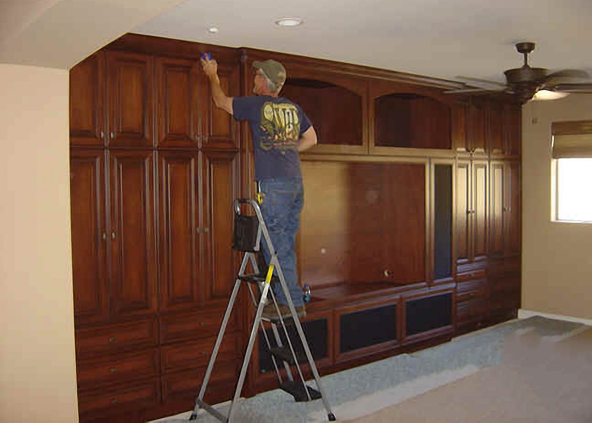 Bob puts the finishing touches on his stunning cabinetry installation.