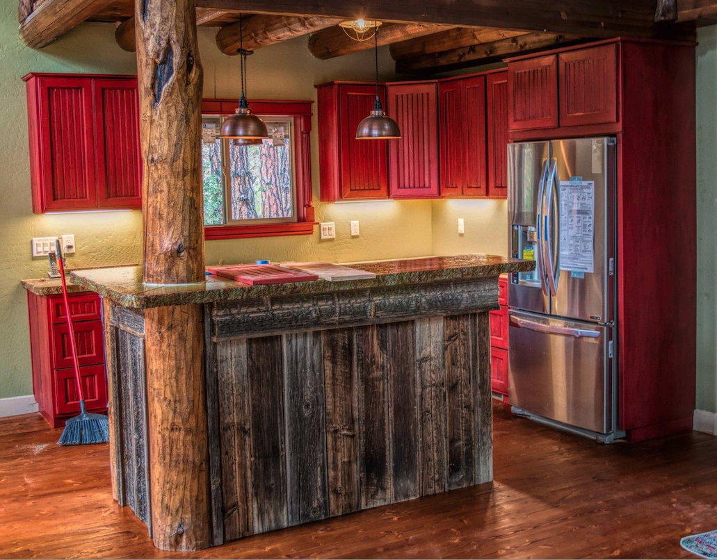 Bob told us, "I made this kitchen a little over five years ago. It's the first red kitchen I built out of the hundreds I've made. The wood is over 100 years old."
